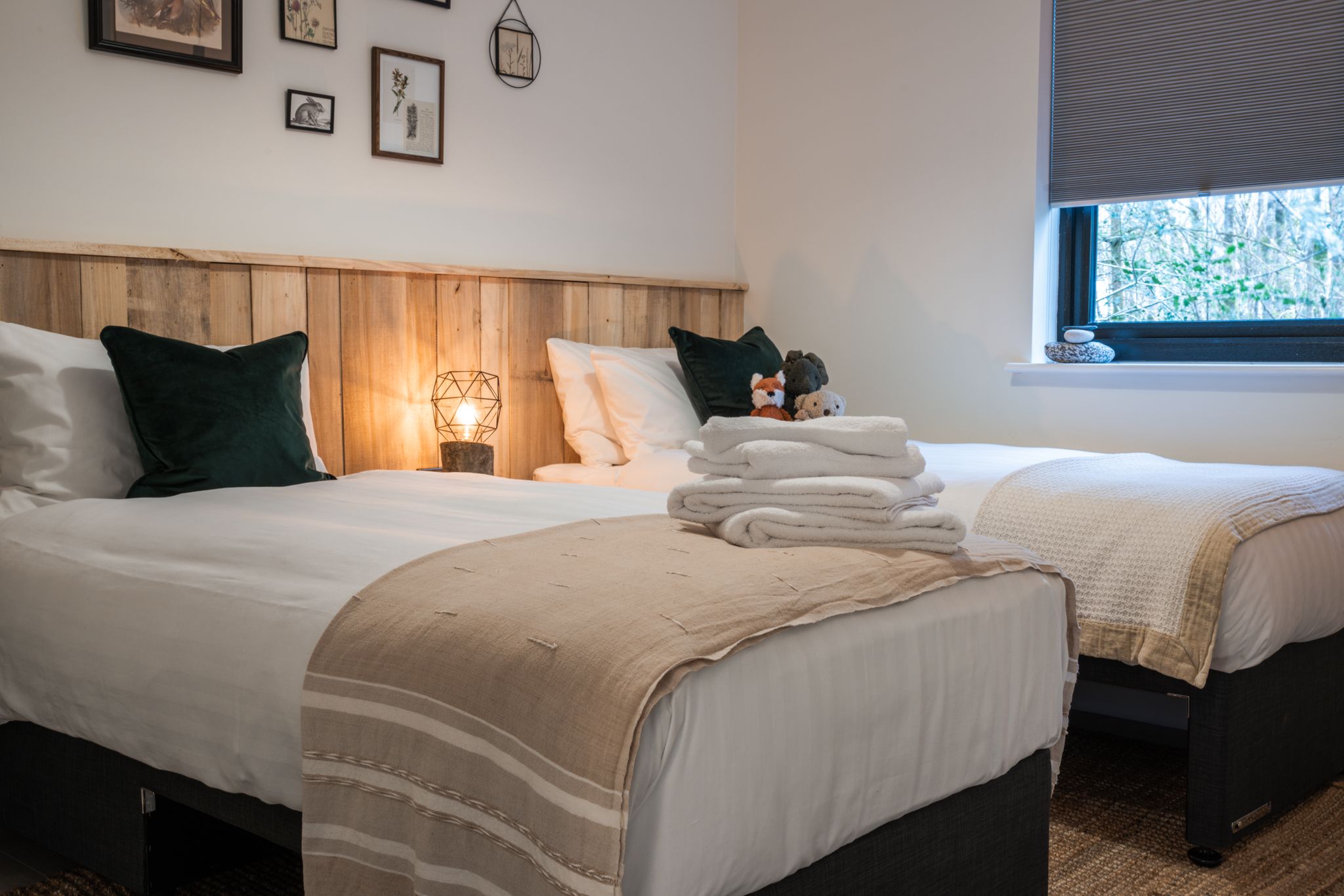Bedroom with estate-timber headboard and soft lamplight