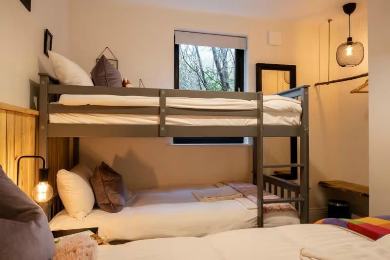 Bunk room with full-size bunks — the third bedroom that sleeps four