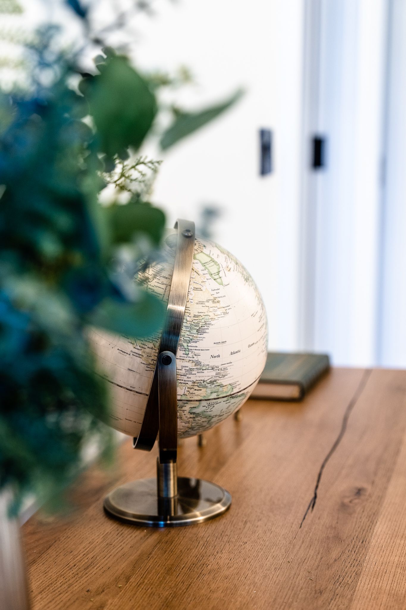 A decorative orb catching the light on the windowsill