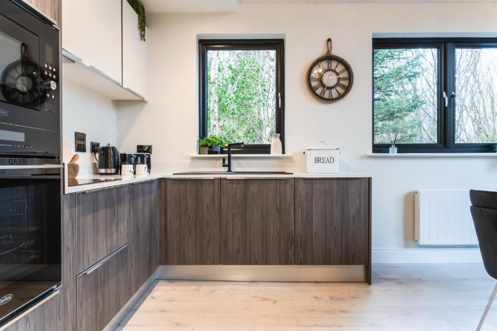 Full kitchen with island and woodland views