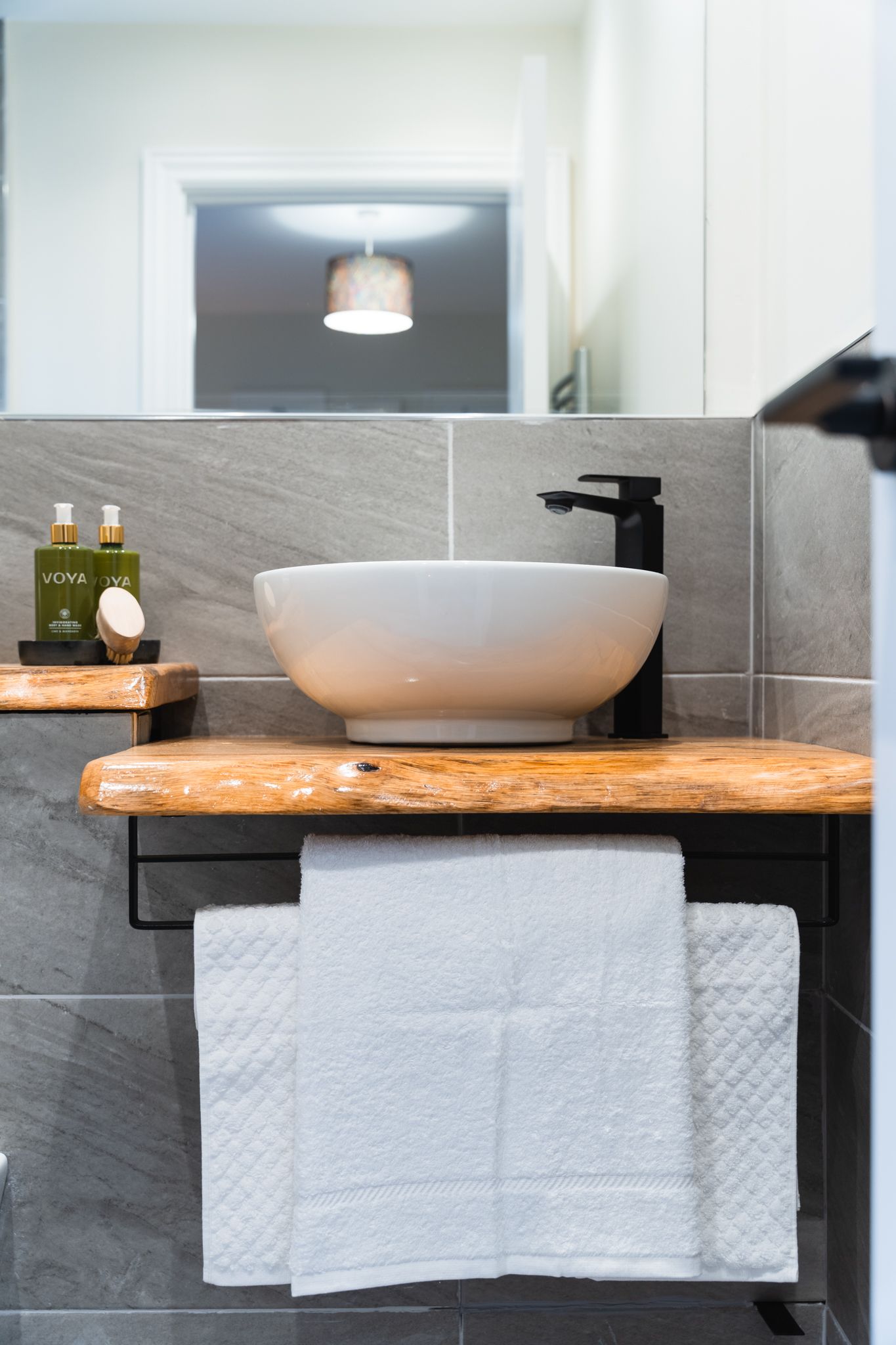 Bathroom with live-edge vanity and walk-in shower