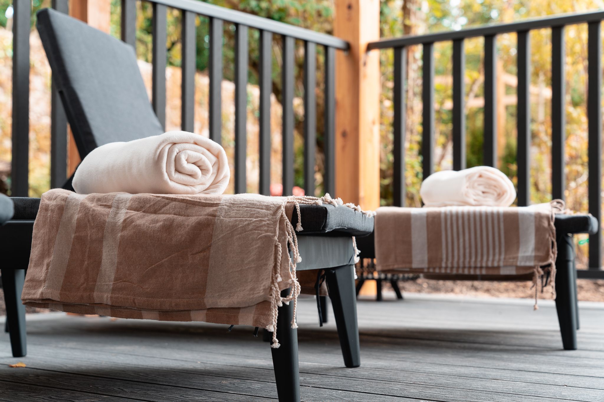 Loungers and rolled towels on the relaxation deck