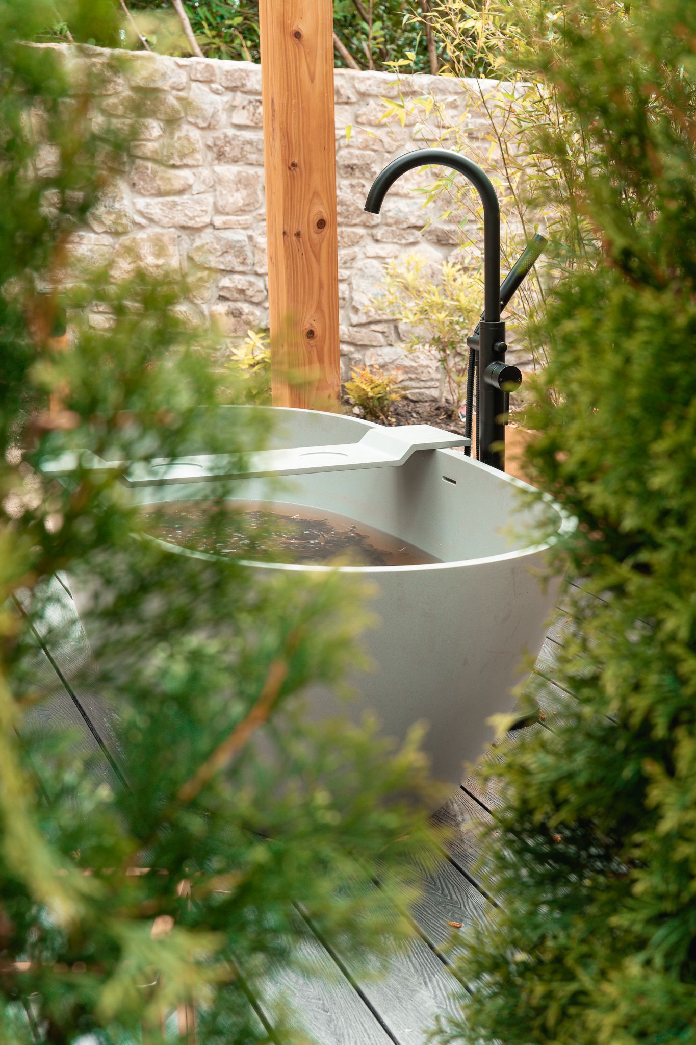 A stone soaking bath in the walled-garden Sanctuary