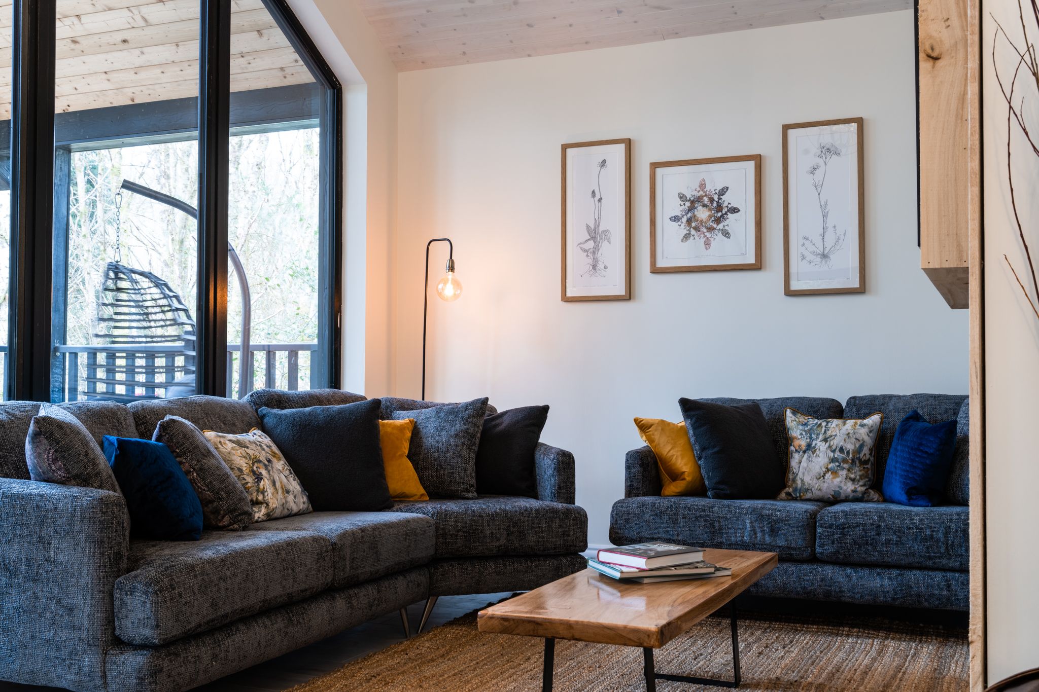 Wildflower living room with deep sofas and a gable window
