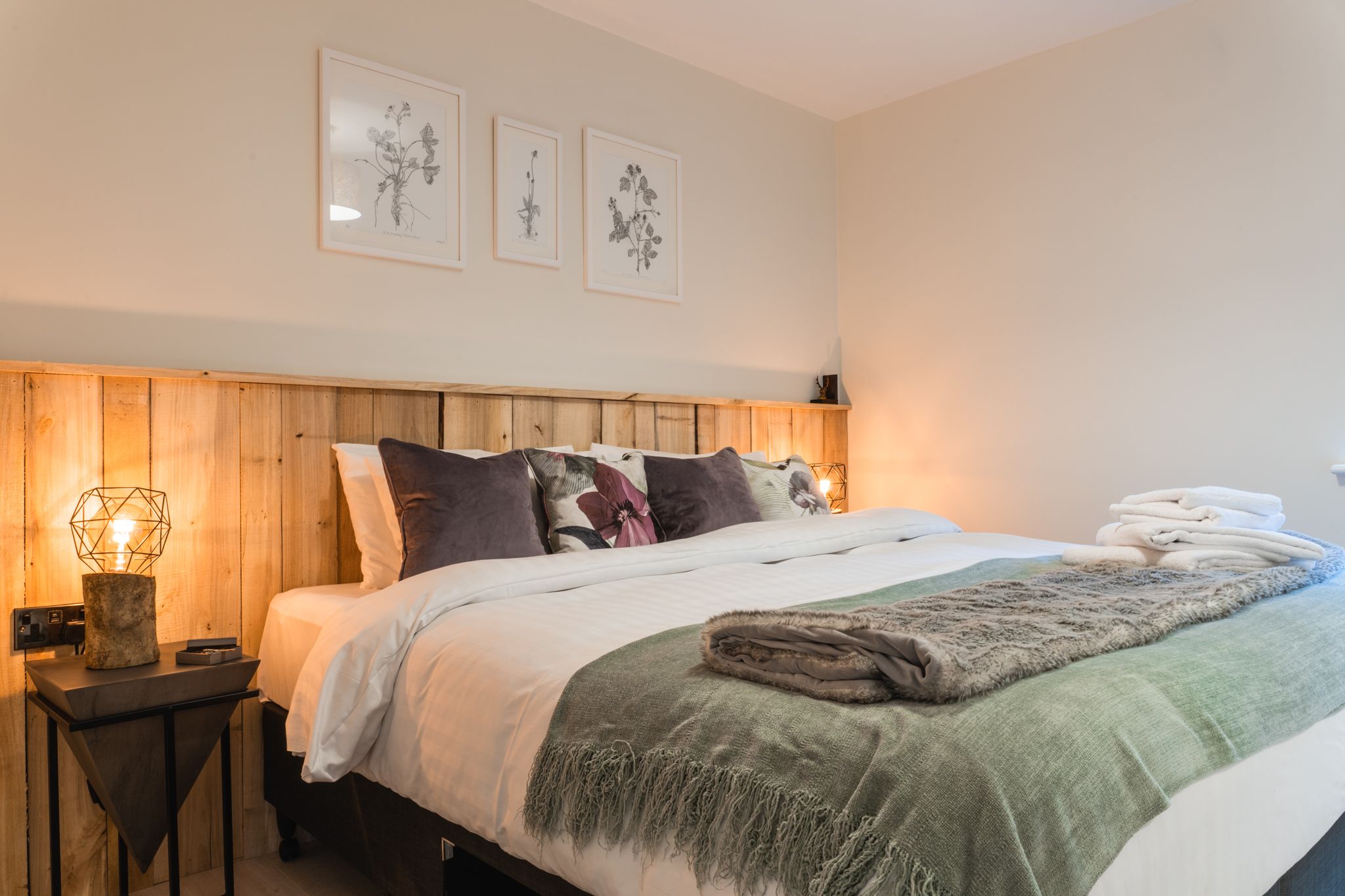 Wildflower lodge bedroom made up with crisp linen